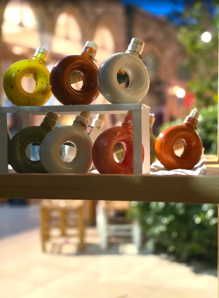 Colourful handmade Moon bottles arranged on a display shelf
